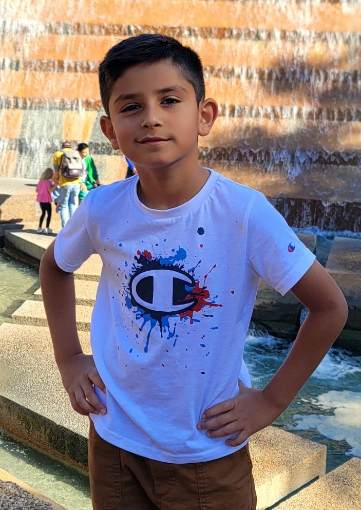 Sameep standing by a fountain
